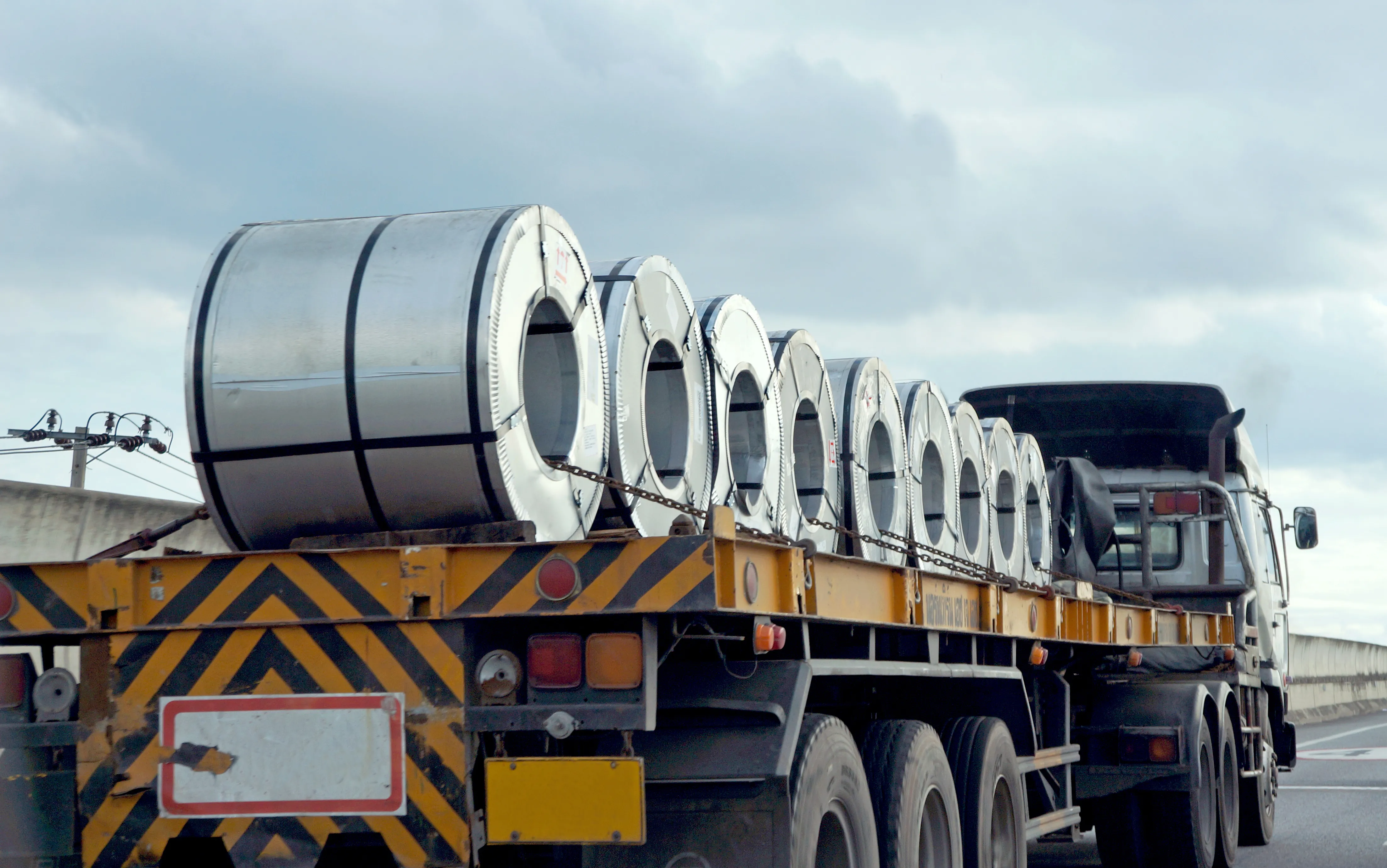 Flatbed trailer loaded with steel coils